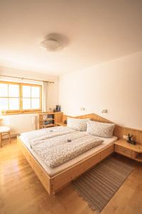 a bedroom with a large bed in a room at Chalet Obenland Kitzbühler Alpen in Bramberg am Wildkogel