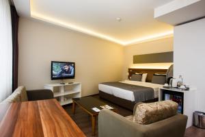 a hotel room with a bed and a table at P Galata Hotel - Special Category in Istanbul