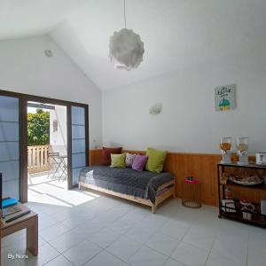 a bedroom with a bed and a sliding glass door at Apartment El Barco - Las Casas de Aron in Caleta De Fuste