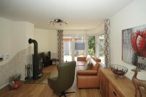 Posezení v ubytování Ferienhaus Kiebitz mit Sauna