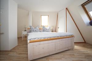 Postel nebo postele na pokoji v ubytování Ferienhaus Kiebitz mit Sauna