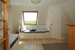 Postel nebo postele na pokoji v ubytování Ferienhaus Kiebitz mit Sauna