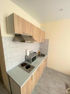 Η κουζίνα ή μικρή κουζίνα στο FlatService Smart House