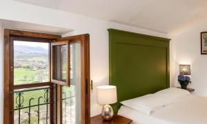A bed or beds in a room at Topazio
