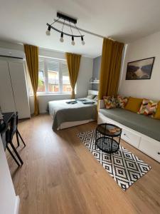 Postel nebo postele na pokoji v ubytování Harmony apartman