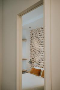 a bedroom with a bed and a mirror at Rincon 13 - Mares in Torre del Mar +37 photos
