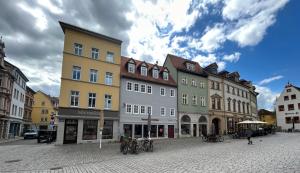a group of buildings on a city street at Schlafen in Weimar in Weimar