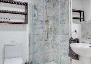 a bathroom with a shower and a sink at Broomhurst Grove in Mayfield