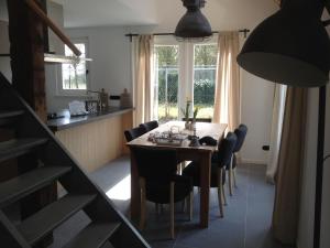 a dining room with a table and some chairs at Bed & Breakfast Zeeland in Renesse