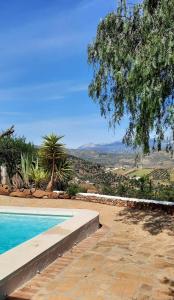 Bassenget på eller i nærheten av 3 bedrooms house with private pool enclosed garden and wifi at Los Romanes