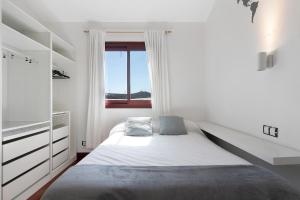 Postel nebo postele na pokoji v ubytování Chalet Vacacional El Agujero + 30 fotografií