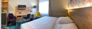 Ένα ή περισσότερα κρεβάτια σε δωμάτιο στο HKK Hotel Wernigerode