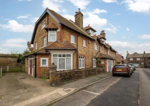 a brick house on the side of a street at Goodwin Cottage in Broadstairs