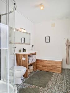 a bathroom with a toilet and a sink and a shower at Fjord Panorama in Stranda