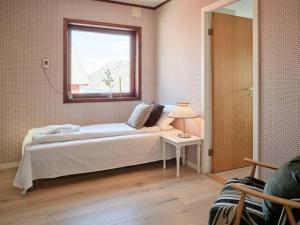 a bedroom with a large bed and a window at Fjord Panorama in Stranda