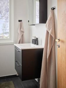 a bathroom with a sink and a window at Fjord Panorama in Stranda