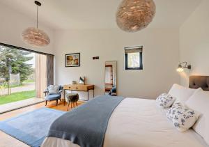 a bedroom with a bed and a desk and a window at Silver Birch in Beckley