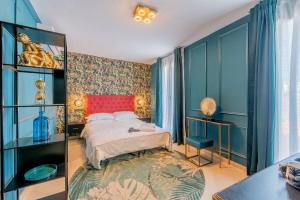 Posteľ alebo postele v izbe v ubytovaní Boutique Suites