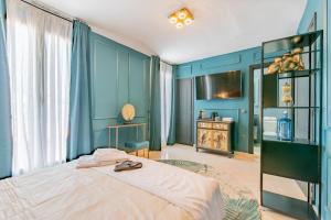 Posteľ alebo postele v izbe v ubytovaní Boutique Suites