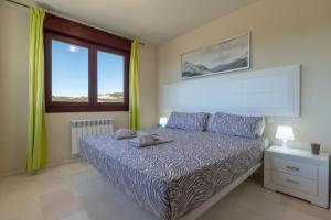 Ένα ή περισσότερα κρεβάτια σε δωμάτιο στο Bahia Casares 4