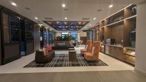 a lobby with couches and chairs in a building at Downtown One Loudoun in Ashburn