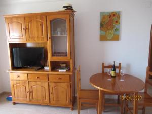 A television and/or entertainment centre at Playa Paraiso - Penthouse Apartment - Secure Free Parking and WiFi