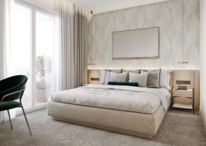 una camera da letto con un letto king size e una sedia di Hotel Sunce a Soko Banja