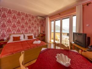 Postel nebo postele na pokoji v ubytování Apartments Stella del Mare