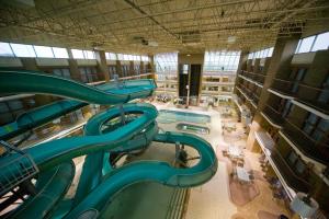 a large indoor water slide in a building at Medicine Hat Lodge, Trademark Collection by Wyndham in Medicine Hat