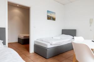 Postel nebo postele na pokoji v ubytování Gemütliches zentrales Apartment - Netflix