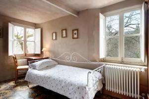 A bed or beds in a room at Agriturismo Il Filo di Paglia