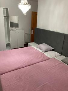 Postel nebo postele na pokoji v ubytování Hospedaria Cidade Berço
