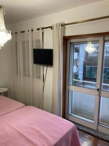 Postel nebo postele na pokoji v ubytování Hospedaria Cidade Berço