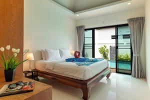 Postel nebo postele na pokoji v ubytování Thai-Themed 3br Boutique Villa by Intira Villas + 13 fotografií