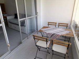a room with a table and two chairs and a bed at Apartment with pool near the beach in Marbella