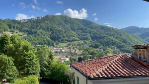 a view of a mountain from a house at Burlamacchi Villas in Bagni di Lucca