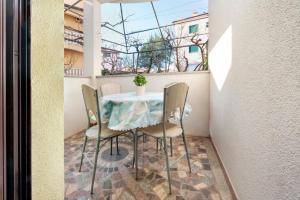 a table and chairs sitting on a balcony at Villa Mara in Rovinj