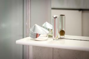 a white shelf with silver items on top of it at Villa Mara in Rovinj +92 photos