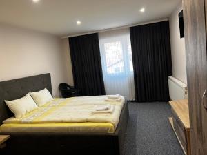 מיטה או מיטות בחדר ב-ArdoSpa Hotel and Restaurant
