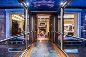 a hallway of a house with a blue ceiling at Hotel Portón de la Cabrera in Bogotá