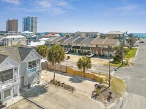 an aerial view of a street with houses and palm trees at Bellas Beach House in Panama City Beach
