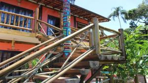 a wooden staircase leading up to a building at Chalés Yababali in Ubatuba