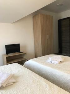 Postel nebo postele na pokoji v ubytování SREBRNA Kap