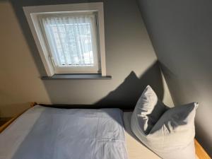 Säng eller sängar i ett rum på Ferienhaus Rennsteighütte 2