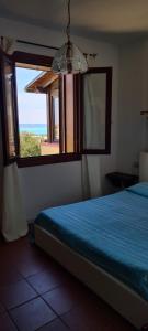 Cama ou camas em um quarto em Casa La Pelosa