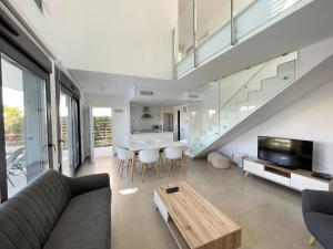 a living room with a couch and a table at Villa BALI 3032 in Vistabella