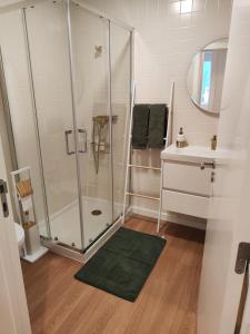 a bathroom with a shower and a sink at Casa Moliceiro Verde in Aveiro