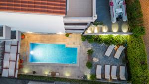 an overhead view of a swimming pool in a building at VILLA PADRE in Podstrana