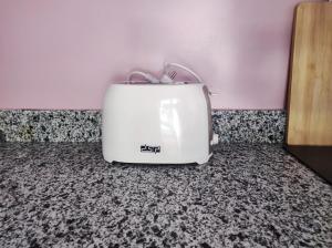 a toaster sitting on a counter next to a wall at Boka Bay One in Hurghada