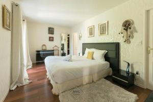 Posteľ alebo postele v izbe v ubytovaní Golf House Disneyland BMYGUEST